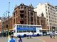 Mercedes 238 in front of Tudor Chambers in Church Square, Pretoria.  Tudor Chambers is the only building in central Pretoria that has  remained in it original conditon, it was designed by John Ellis for George Heys and was completed in 1904. Photo  Richard Gillatt 2004