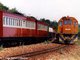 91-018 with limestone train - Summit Station - passing a special passenger train to Patensie Citrus Co-op - Photo Peter Burton Collection