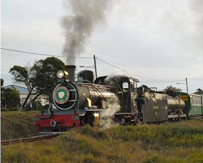 he late afternoon sun reflects off the side of NG15 no. 119 as she heads home, winding her way through the suburbs of Port Elizabeth after a day out in the country.