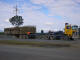 Here we see the full bins rolling off the truck simply by means of the small incline