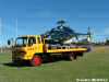 Isuzu breakdown truck with Bell Jet helicopter on flatbed